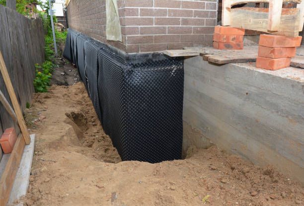 Happy homeowners after waterproofing job in Ada